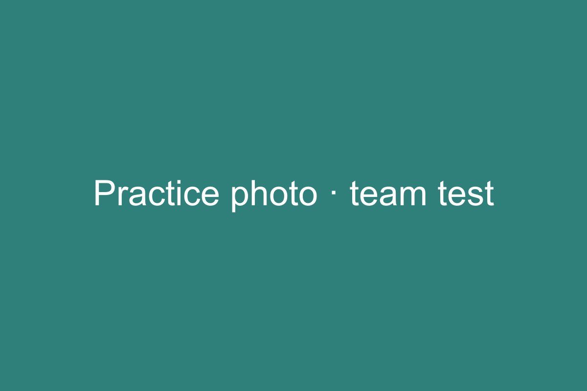 A plain teal panel with the words "Practice photo · team test" in white